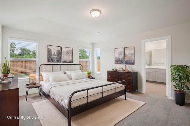 7746 Beaufort Ln, Baytown, TX 77523 - bedroom with light carpet and ensuite bath