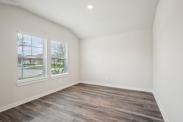 7746 Beaufort Ln, Baytown, TX 77523 - spare room featuring lofted ceiling, baseboards, dark wood-style floors, and recessed lighting
