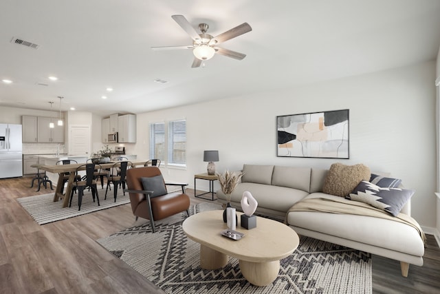 7746 Beaufort Ln, Baytown, TX 77523 - living area featuring wood finished floors, recessed lighting, and a ceiling fan
