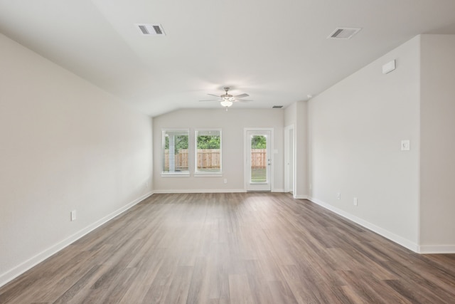 7746 Beaufort Ln, Baytown, TX 77523 - unfurnished living room featuring ceiling fan, wood finished floors, baseboards, and lofted ceiling
