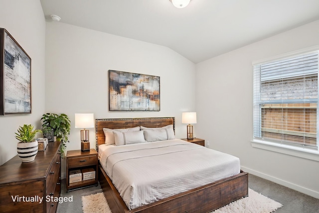 7746 Beaufort Ln, Baytown, TX 77523 - bedroom with carpet floors, vaulted ceiling, and baseboards