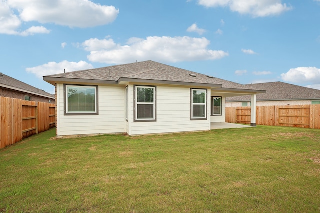 7746 Beaufort Ln, Baytown, TX 77523 - back of property with a patio area and roof with shingles