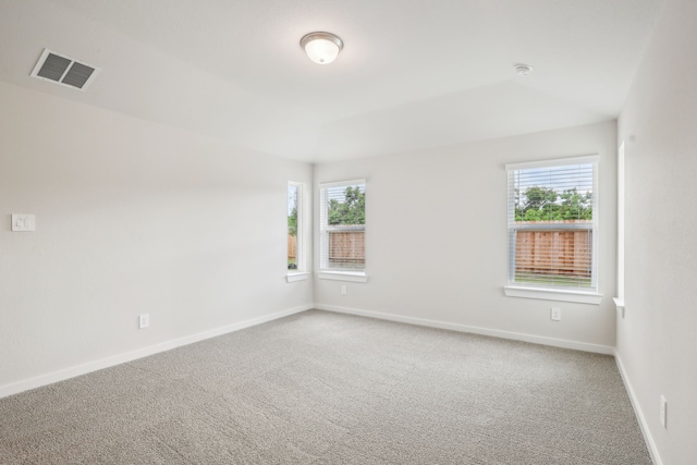 7746 Beaufort Ln, Baytown, TX 77523 - carpeted spare room featuring plenty of natural light, baseboards, and a smoke detector