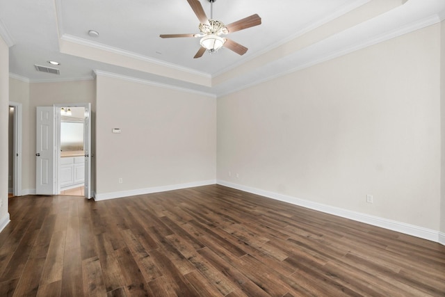 20960 Sweetwood Cir, Porter, TX 77365 - unfurnished room featuring dark wood finished floors, baseboards, a ceiling fan, crown molding, and a raised ceiling