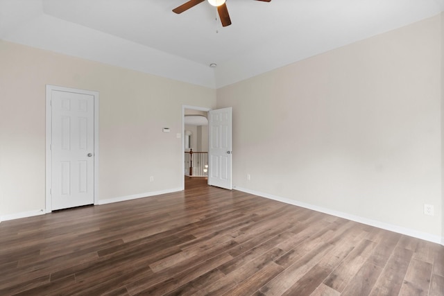 20960 Sweetwood Cir, Porter, TX 77365 - spare room featuring baseboards, a ceiling fan, and dark wood-type flooring