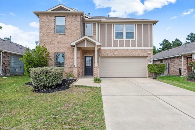 438 Camas Creek Ln, Magnolia, TX 77354 - view of front of property featuring an attached garage, a front lawn, brick siding, and driveway