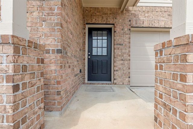 438 Camas Creek Ln, Magnolia, TX 77354 - property entrance with a garage and brick siding