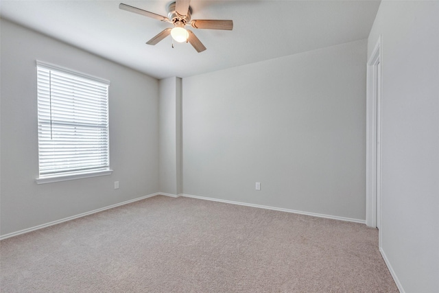 438 Camas Creek Ln, Magnolia, TX 77354 - carpeted empty room featuring baseboards and a ceiling fan