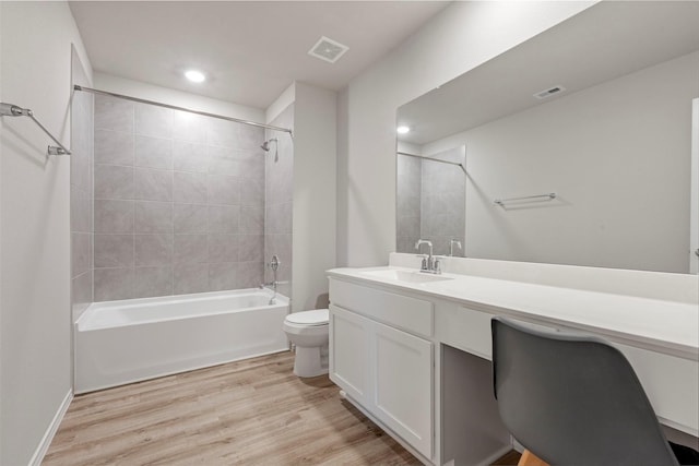 438 Camas Creek Ln, Magnolia, TX 77354 - full bathroom featuring toilet, tub / shower combination, wood finished floors, visible vents, and vanity