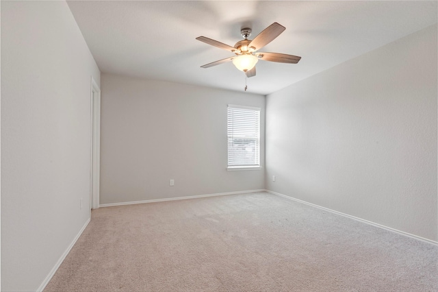 438 Camas Creek Ln, Magnolia, TX 77354 - unfurnished room featuring ceiling fan, light colored carpet, and baseboards