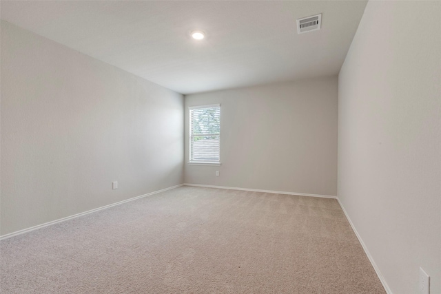 438 Camas Creek Ln, Magnolia, TX 77354 - empty room featuring baseboards, recessed lighting, visible vents, and light colored carpet
