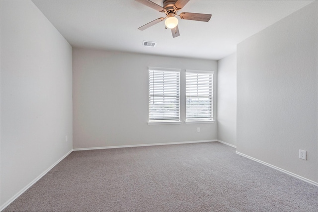438 Camas Creek Ln, Magnolia, TX 77354 - empty room with carpet flooring, visible vents, baseboards, and a ceiling fan