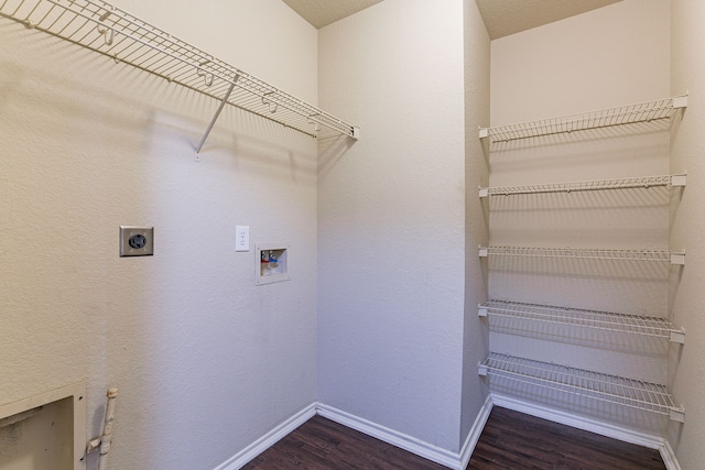 clothes washing area featuring laundry area, wood finished floors, hookup for an electric dryer, baseboards, and washer hookup