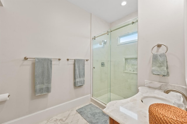 bathroom with a stall shower, vanity, marble finish floor, baseboards, and recessed lighting
