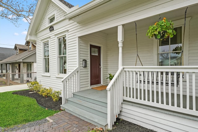 entrance to property with a porch