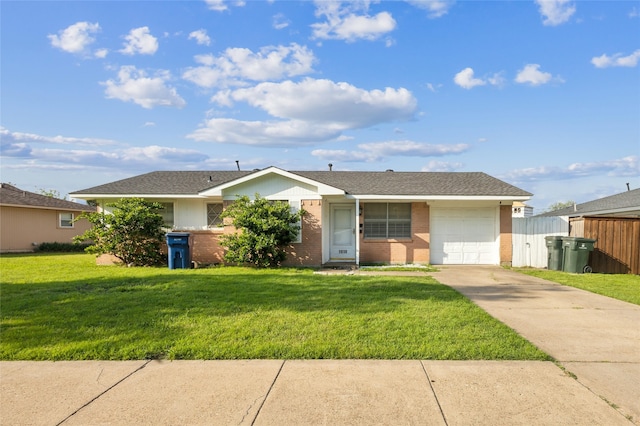 ranch-style home with an attached garage, driveway, brick siding, and a front yard