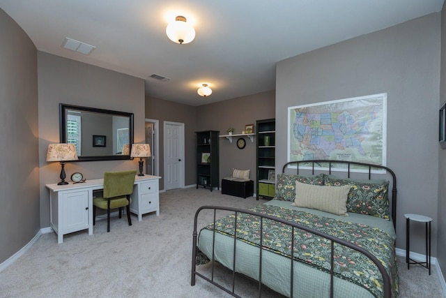 bedroom featuring baseboards, light carpet, and visible vents