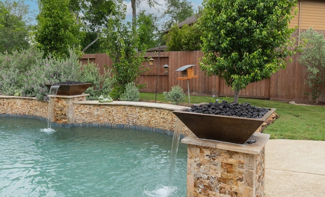 view of swimming pool featuring a fenced backyard