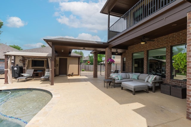 view of patio featuring ceiling fan, an outdoor living space, an outdoor pool, fence, and a balcony