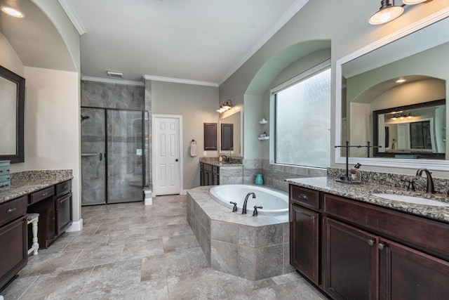 full bathroom featuring a bath, visible vents, a stall shower, a sink, and ornamental molding