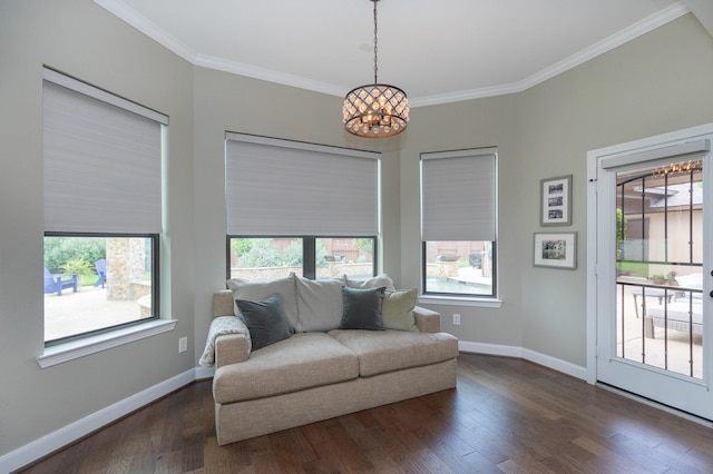 living area featuring an inviting chandelier, dark wood-style flooring, baseboards, and a healthy amount of sunlight