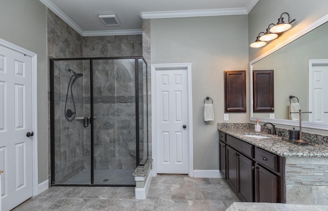 full bathroom featuring visible vents, a stall shower, vanity, baseboards, and ornamental molding