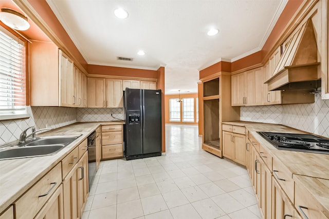 9402 Stockport Dr, Spring, TX 77379 - kitchen featuring black appliances, light brown cabinetry, a sink, premium range hood, and recessed lighting