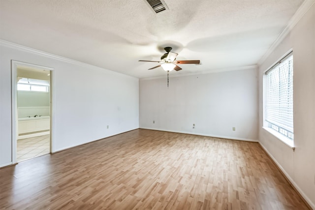 9402 Stockport Dr, Spring, TX 77379 - empty room with wood finished floors, ceiling fan, crown molding, a textured ceiling, and baseboards