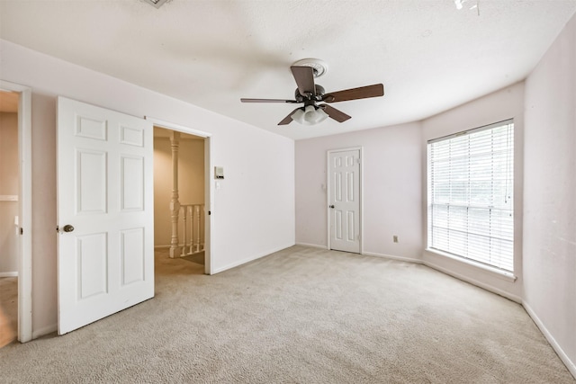 9402 Stockport Dr, Spring, TX 77379 - unfurnished bedroom featuring carpet floors, baseboards, a closet, and a ceiling fan
