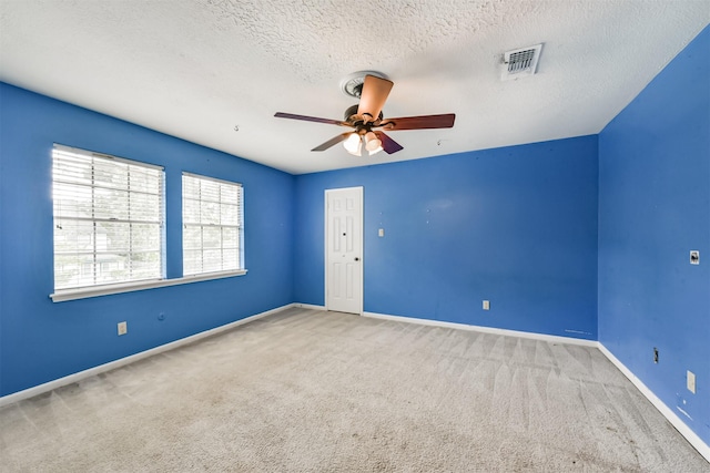 9402 Stockport Dr, Spring, TX 77379 - carpeted spare room featuring a ceiling fan, a textured ceiling, and baseboards