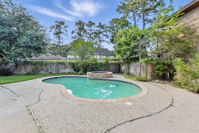 9402 Stockport Dr, Spring, TX 77379 - view of swimming pool featuring a fenced backyard, a patio area, and a pool with connected hot tub