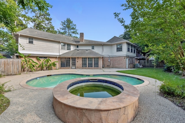 9402 Stockport Dr, Spring, TX 77379 - view of pool with a patio area and a pool with connected hot tub