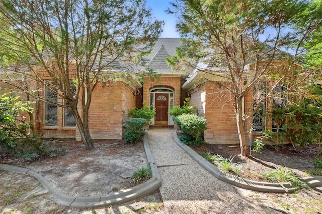 9402 Stockport Dr, Spring, TX 77379 - view of front of house with roof with shingles and brick siding