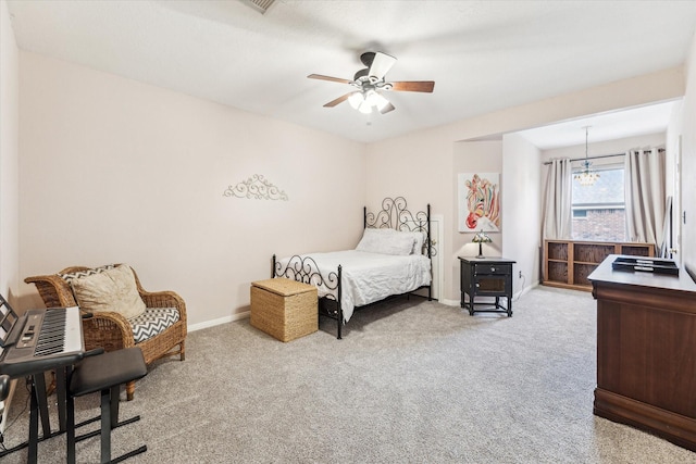 bedroom with baseboards, ceiling fan, and carpet flooring