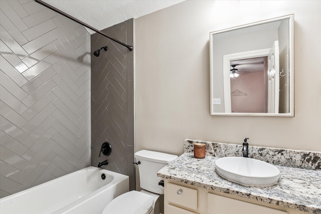 full bathroom with vanity, a ceiling fan, tub / shower combination, and toilet