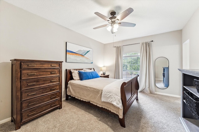 bedroom featuring baseboards and light carpet