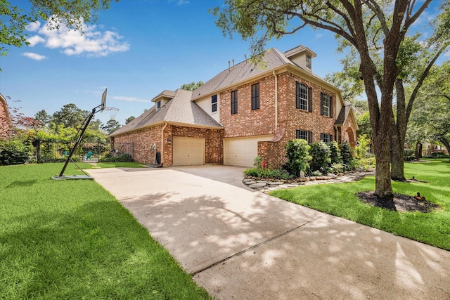 view of home's exterior featuring a yard, brick siding, and concrete driveway