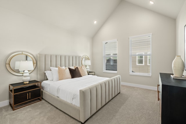 bedroom with light colored carpet, baseboards, and recessed lighting