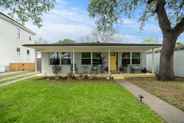 1211 35th St, Galveston, TX 77550 - view of front of home with a front yard and covered porch