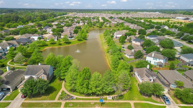 bird's eye view featuring a water view and a residential view