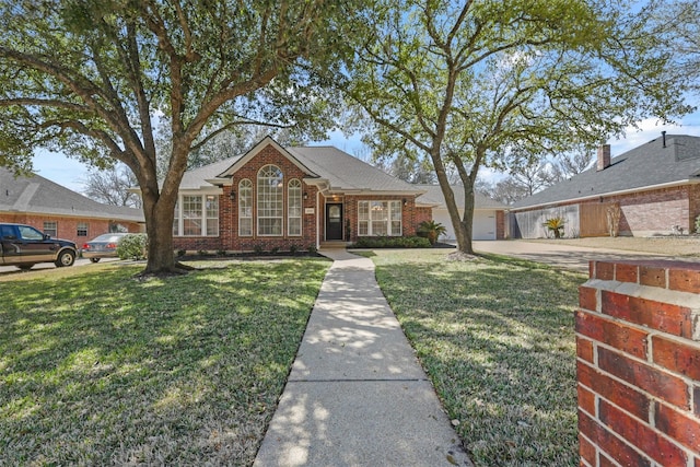 view of front of home featuring brick siding, a garage, a front lawn, and concrete driveway