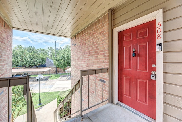 2023 Gentryside Dr Unit 508, Houston, TX 77077 - doorway to property featuring brick siding and covered porch