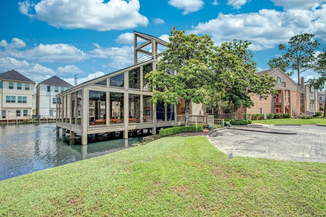 2023 Gentryside Dr Unit 508, Houston, TX 77077 - back of house featuring a lawn, a sunroom, and a water view