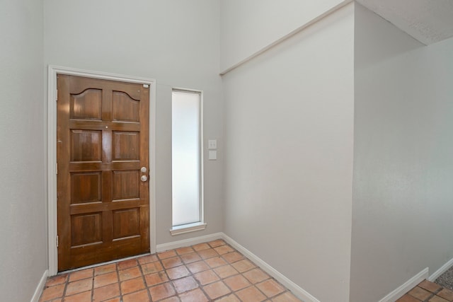 5893 Southern Hills Dr, Houston, TX 77069 - foyer with baseboards and light tile patterned floors