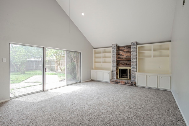 5893 Southern Hills Dr, Houston, TX 77069 - unfurnished living room with a brick fireplace, a healthy amount of sunlight, carpet flooring, and high vaulted ceiling
