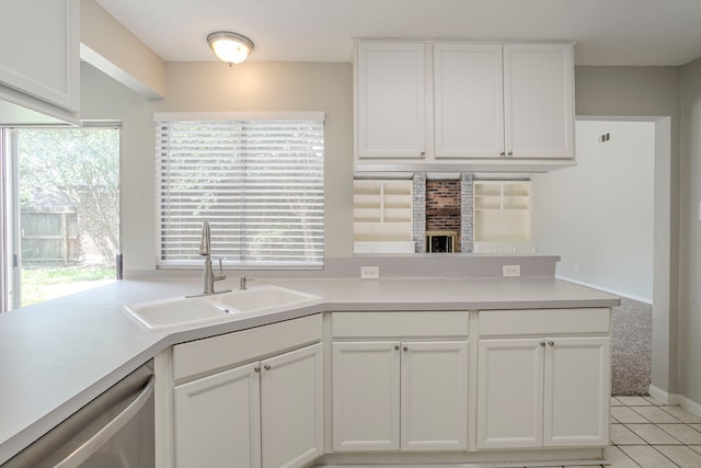 5893 Southern Hills Dr, Houston, TX 77069 - kitchen with dishwasher, white cabinets, a sink, and light countertops