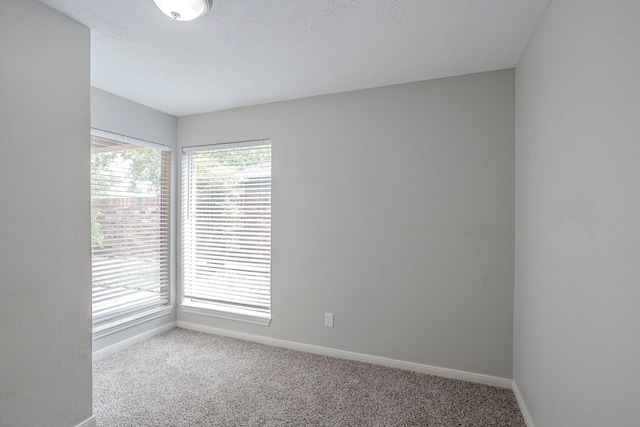 5893 Southern Hills Dr, Houston, TX 77069 - empty room with baseboards and carpet flooring