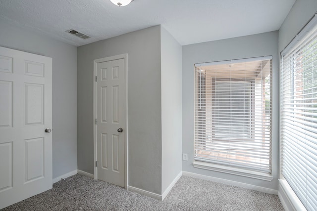 5893 Southern Hills Dr, Houston, TX 77069 - unfurnished bedroom with baseboards, visible vents, and carpet flooring