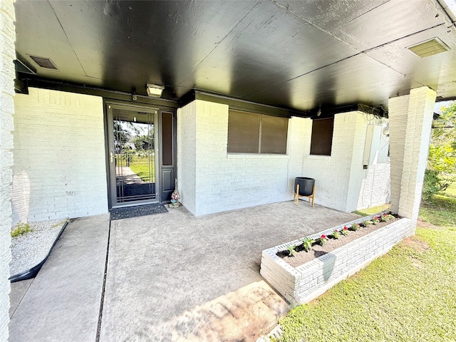 view of patio featuring visible vents