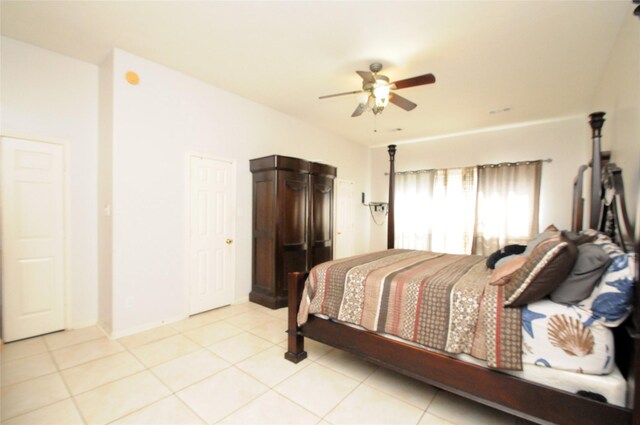 2631 Plantation Hollow Ct, Missouri City, TX 77459 - bedroom with light tile patterned floors, a ceiling fan, and baseboards